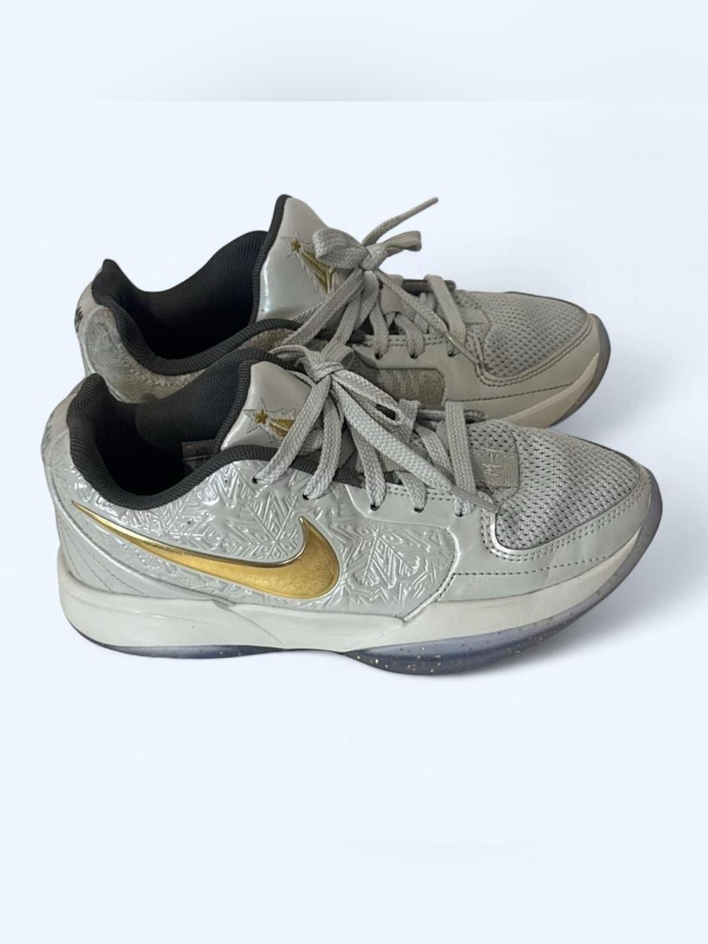Nike Women's Gray Sneakers with Gold Swoosh Accent